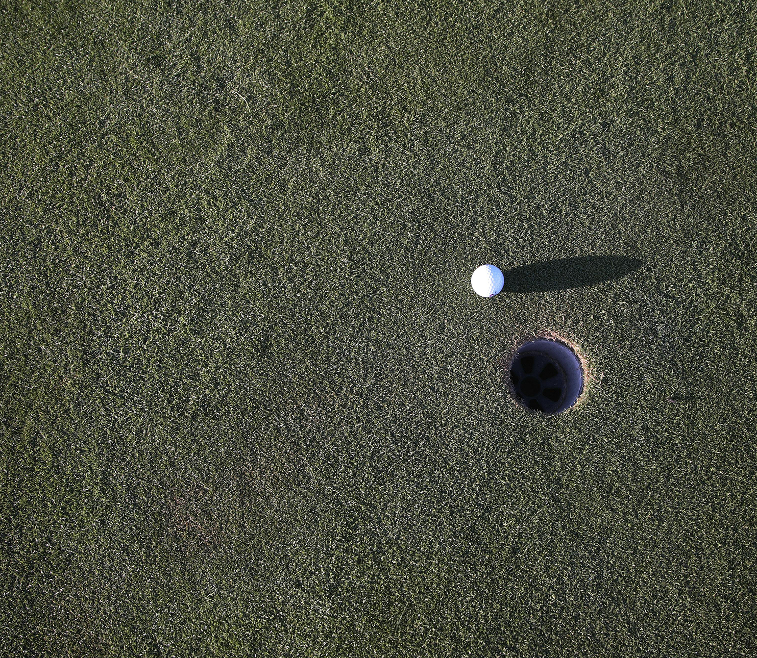 golf ball near hole